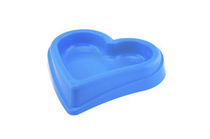Plastic dog bowl in shape of a heart, good for any size dog