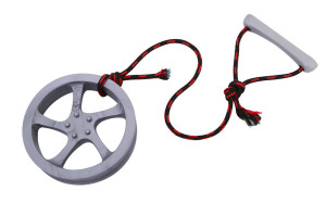 Large dog toy fetcher made from rubber shaped rim tire and rope with handle